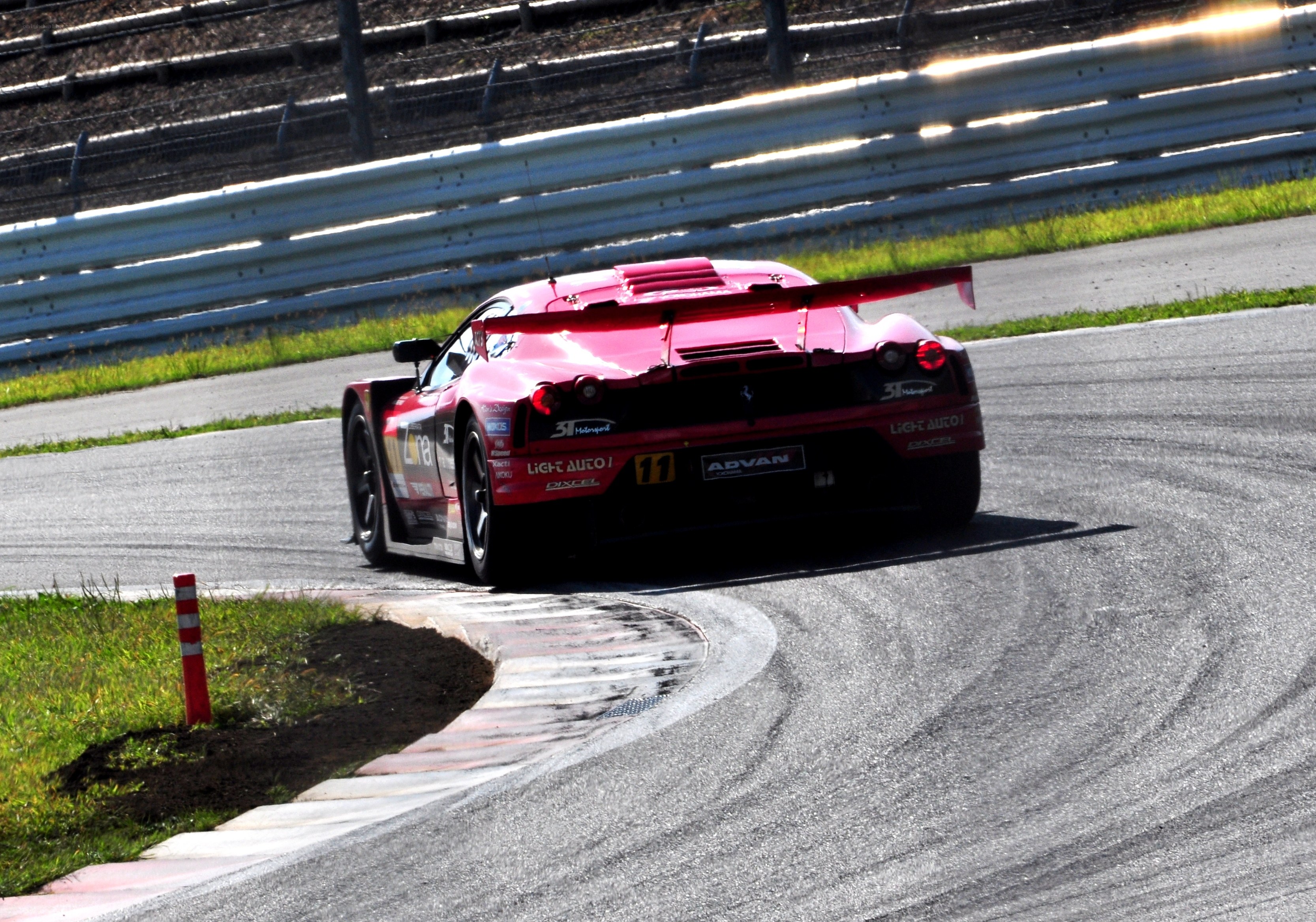 Red race car on track