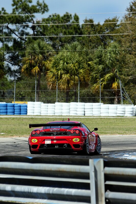 Red race car on track