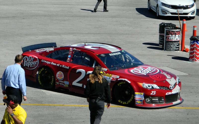 Red Race Car on Track — Active, Afternoon, Photograph, People