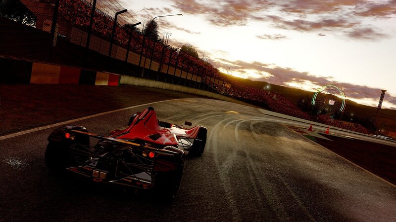 Red race car on track at sunset