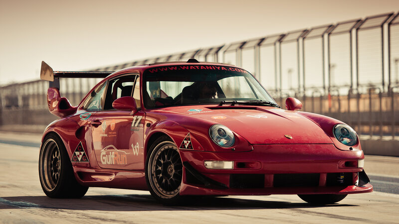 Red Race Car on Track — Dramatic, Afternoon, Photograph, Race Car, Fence
