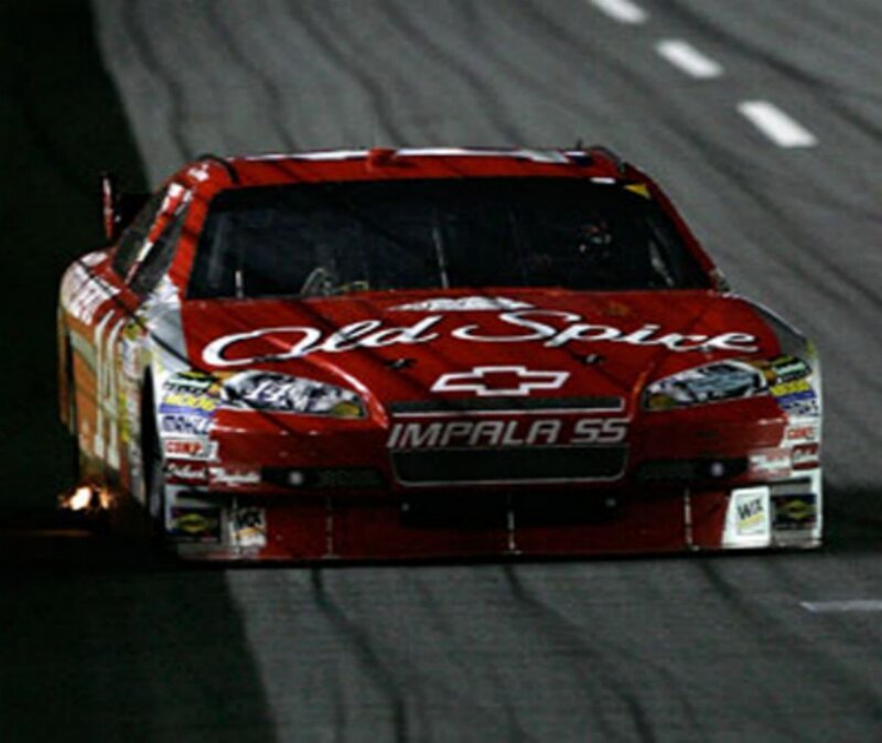 Red Race Car on Track — Dramatic, Night, Photograph, Race Car