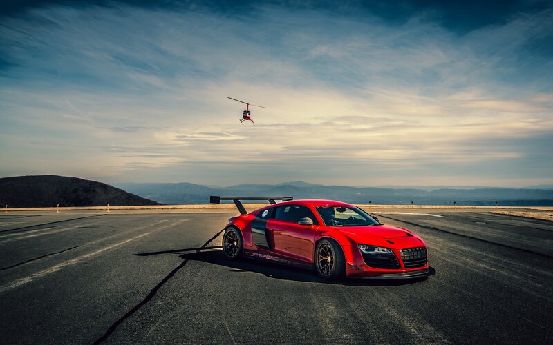 Red Race Car on Track — Dramatic, Sunset, Photograph, Helicopter