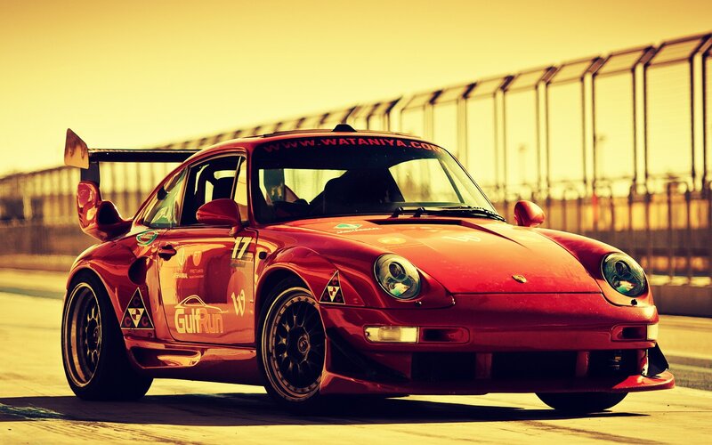 Red Race Car on Track — Dramatic, Sunset, Photograph, Race Car, Fence, Yellow