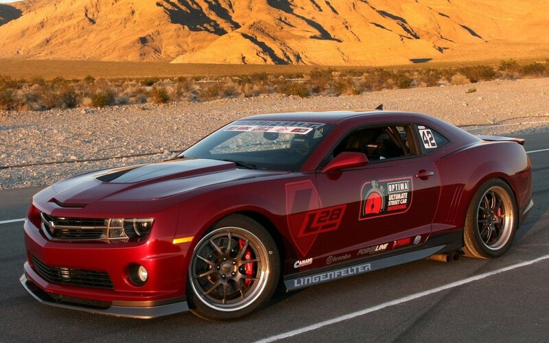 Red Race Car on Track — Dramatic, Sunset, Photograph