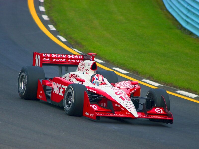 Red Race Car on Track — Dynamic, Afternoon, Photograph, Driver, Grass, Guardrail, Tire