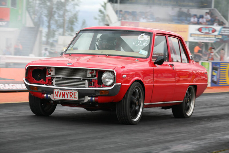 Red Race Car on Track — Dynamic, Afternoon, Photograph, Driver, Race Track, Spectators