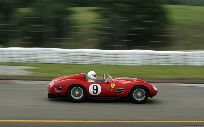 Red Race Car on Track — Dynamic, Afternoon, Photograph, Driver, Race Track, White Barrier
