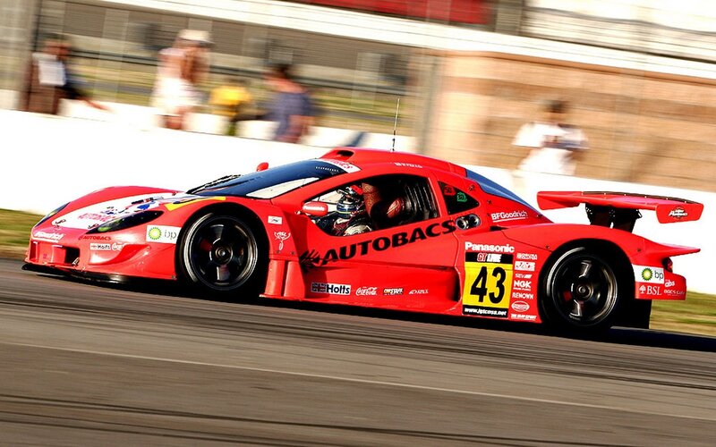 Red Race Car on Track — Dynamic, Afternoon, Photograph, Driver, Spectators
