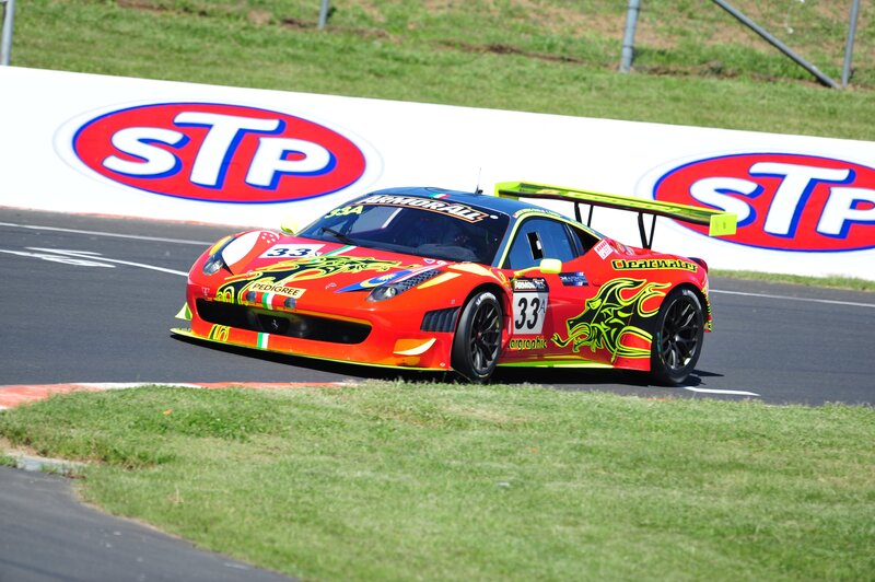 Red Race Car on Track — Dynamic, Afternoon, Photograph, Race Car, Grass