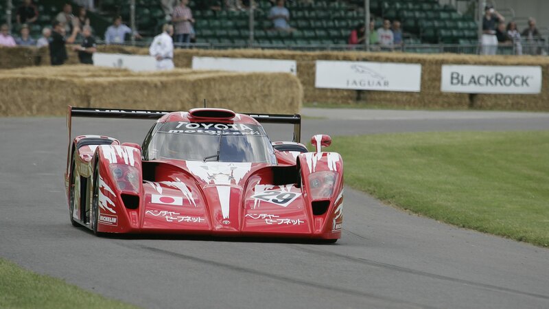 Red Race Car on Track — Dynamic, Afternoon, Photograph, Race Car, Spectators