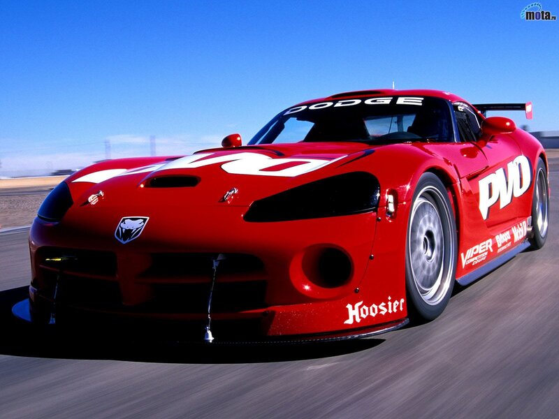 Red Race Car on Track — Dynamic, Afternoon, Photograph, Race Track, Blue Sky