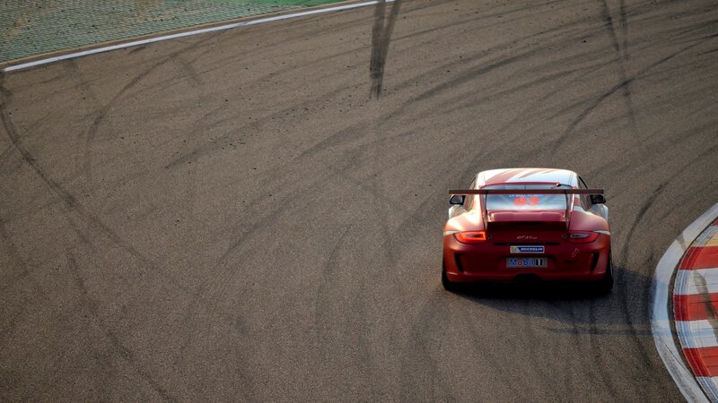 Red Race Car on Track — Dynamic, Afternoon, Photograph, Race Track, Tire Marks