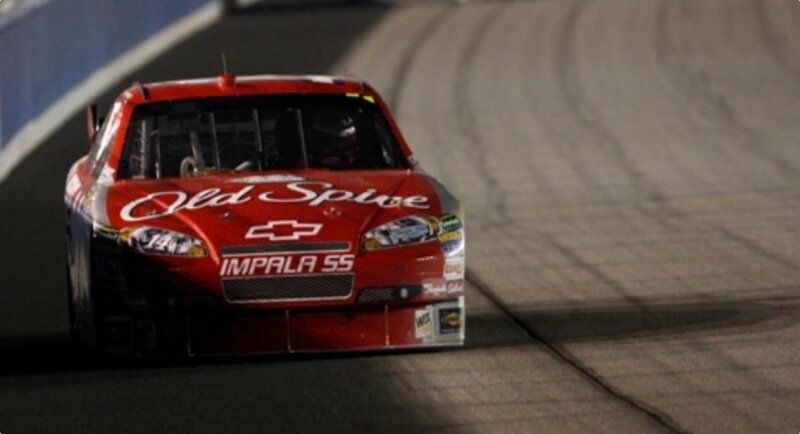 Red Race Car on Track — Dynamic, Night, Photograph, Race Car, Driver, Black