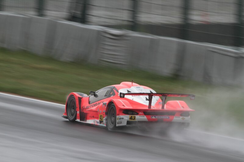 Red Race Car on Track — Dynamic, Photograph, Race Car, Tire Spray
