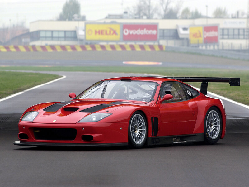 Red Race Car on Track — Dynamic, Photograph, Race Track, Sponsor Signs
