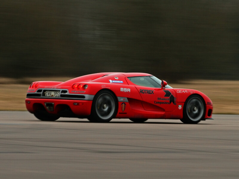 Red Race Car on Track — Dynamic, Photograph, Race Track