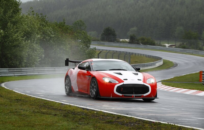 Red race car on wet track