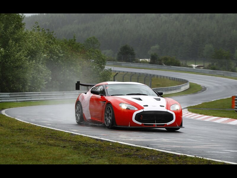 Red race car on wet track