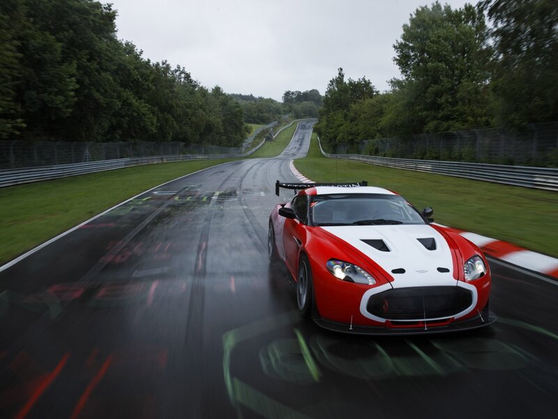 Red race car on wet track