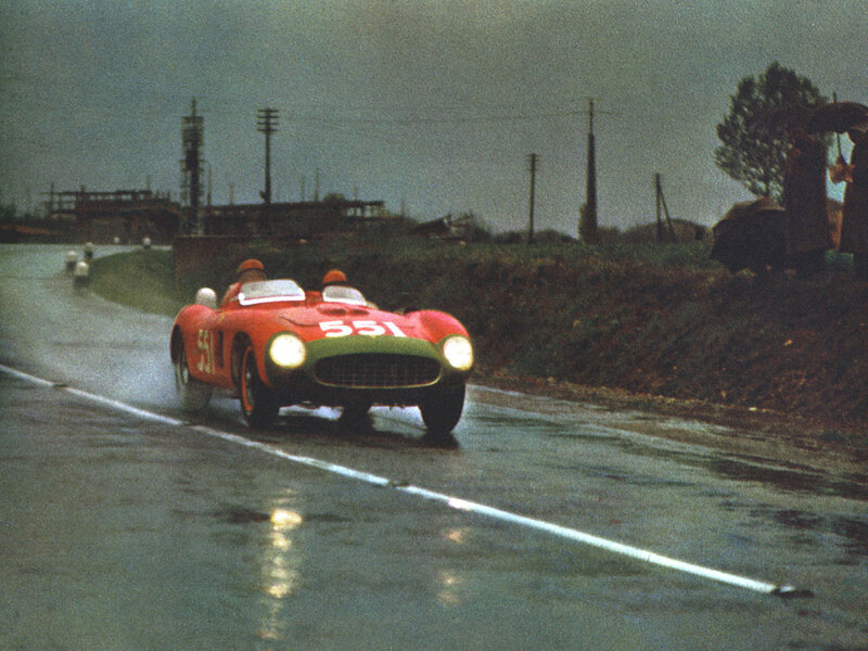 Red race car on wet track