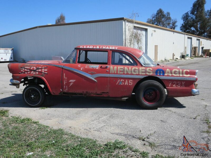 Red Race Car — Outdoor, Afternoon, Photograph, Building