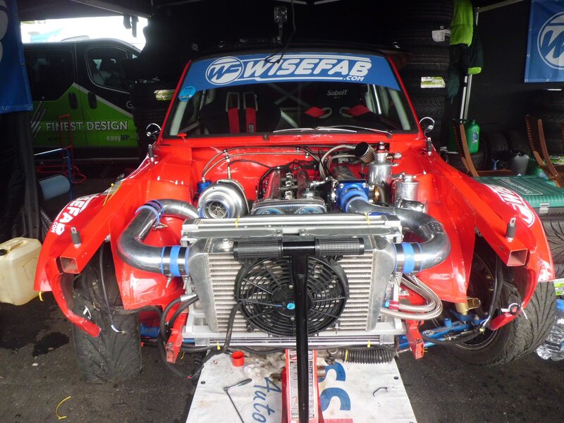 Red race car with exposed engine