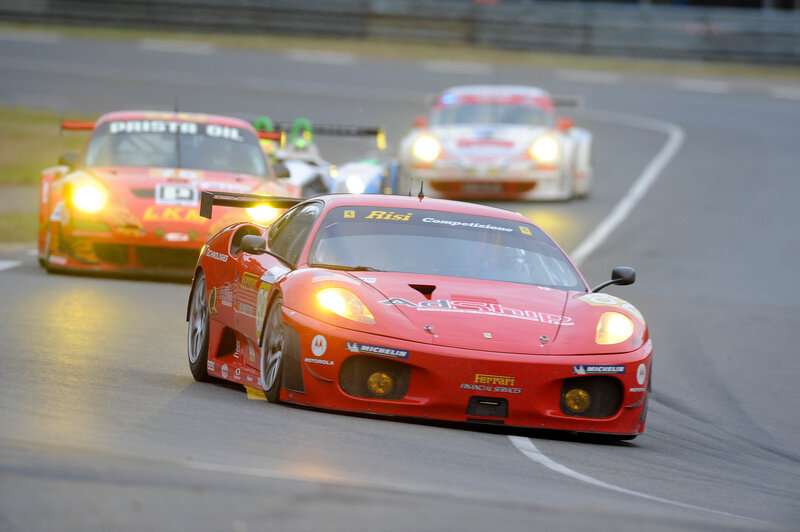 Red race cars on a track