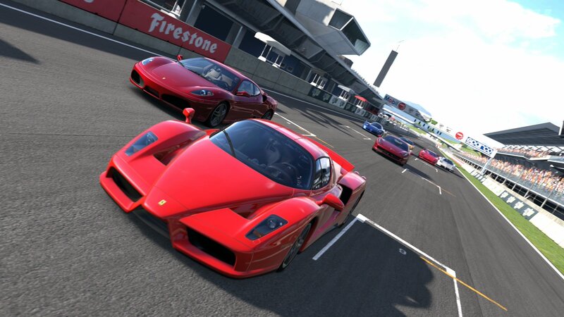 Red race cars on a track