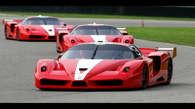 Red race cars on a track