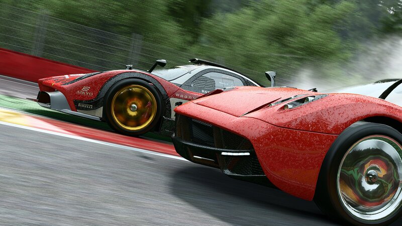 Red race cars on a wet track