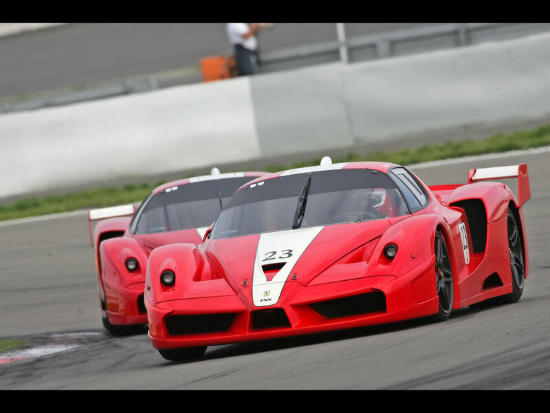 Red race cars on track
