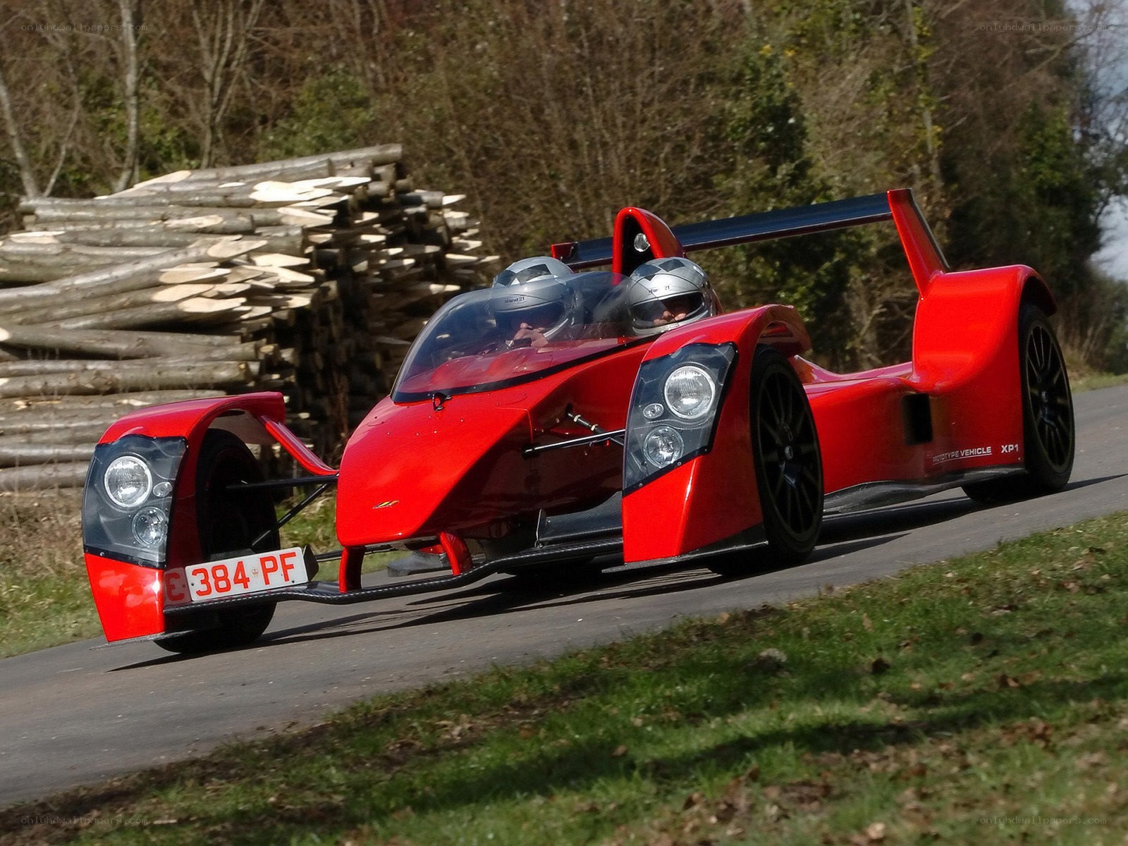 Red racing car on a road