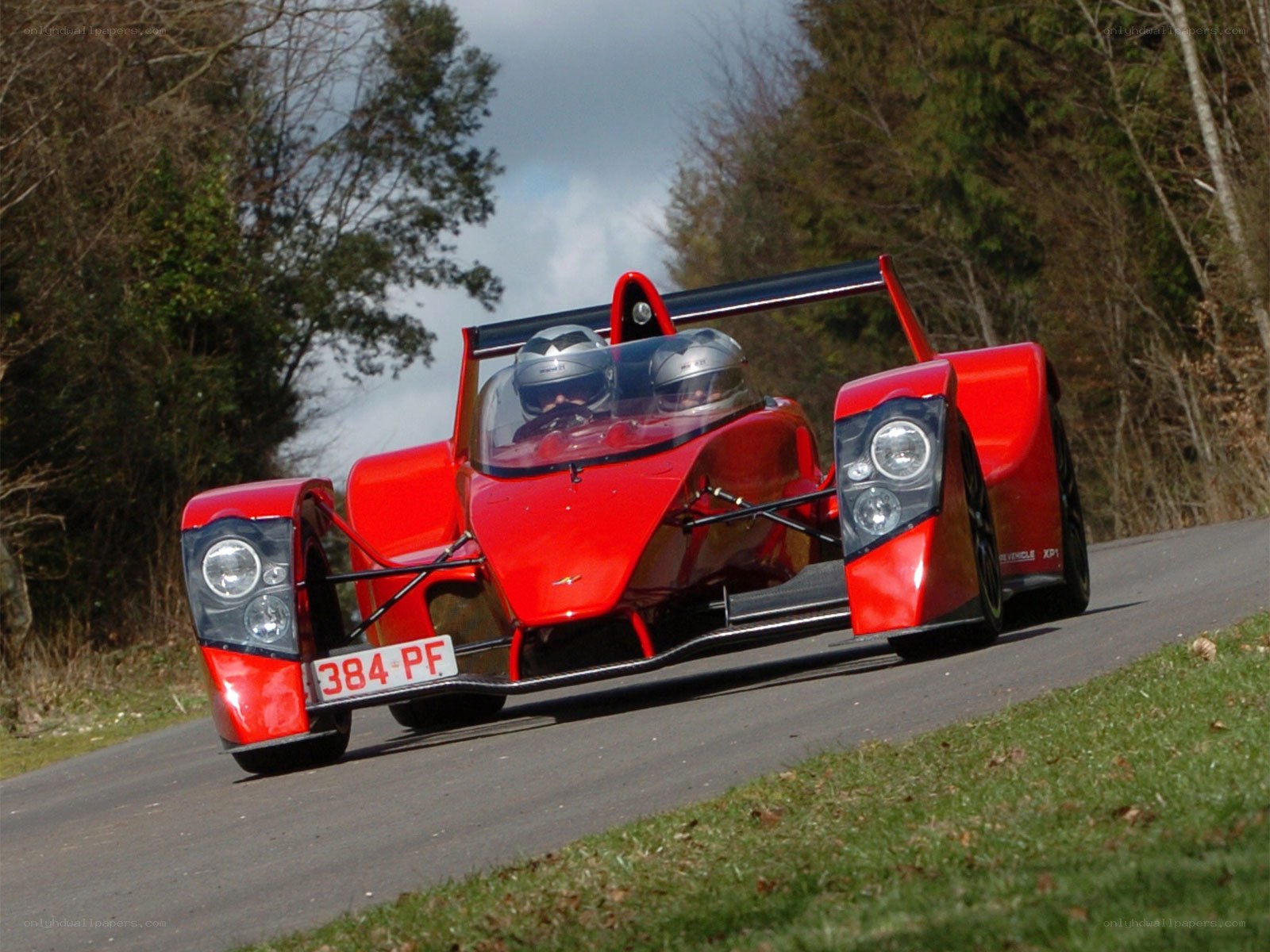 Red racing car on a road