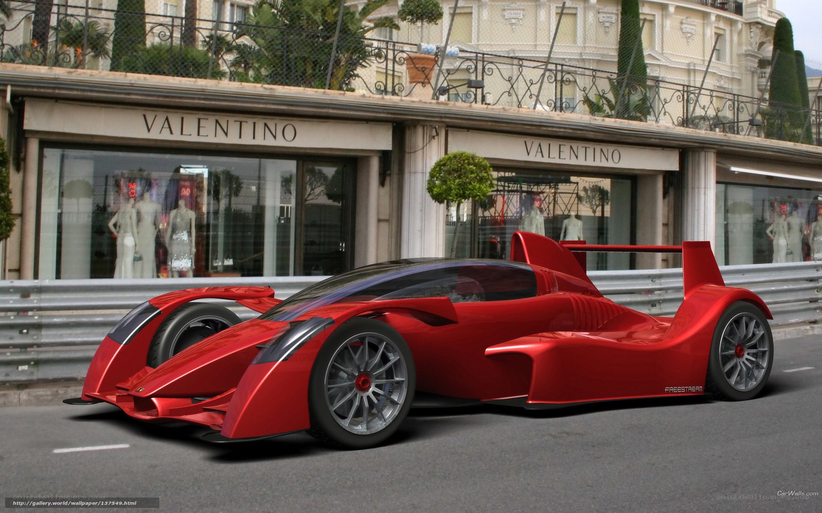 Red racing car on city street