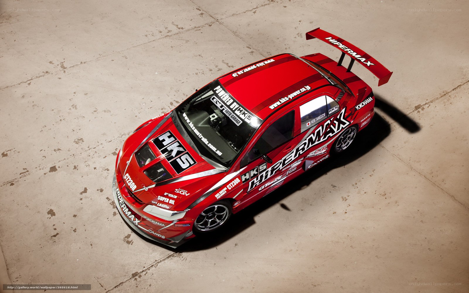 Red racing car with Hipermax branding