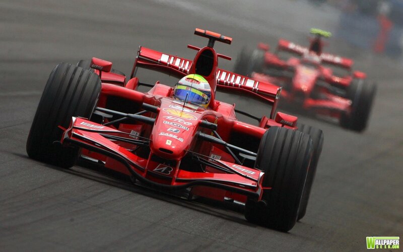Red racing cars on a track