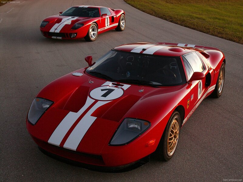 Red racing cars on a track