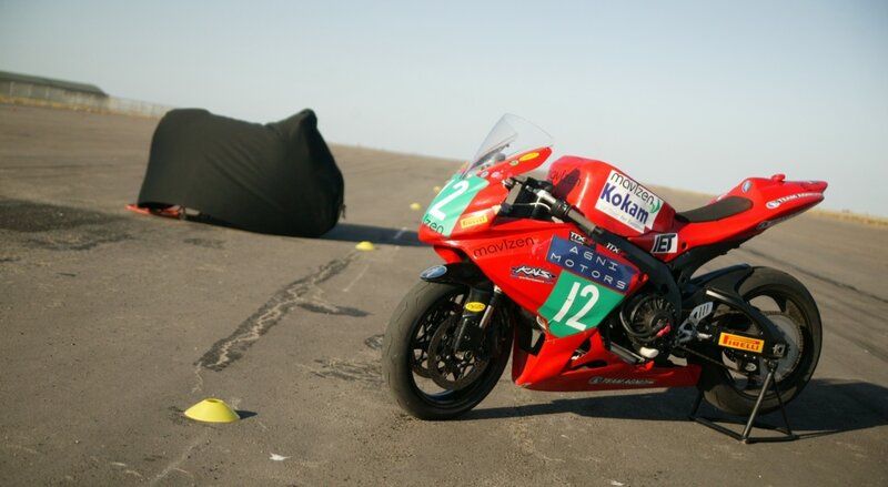 Red racing motorcycle on track