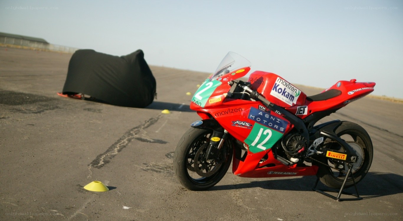 Red racing motorcycle on track