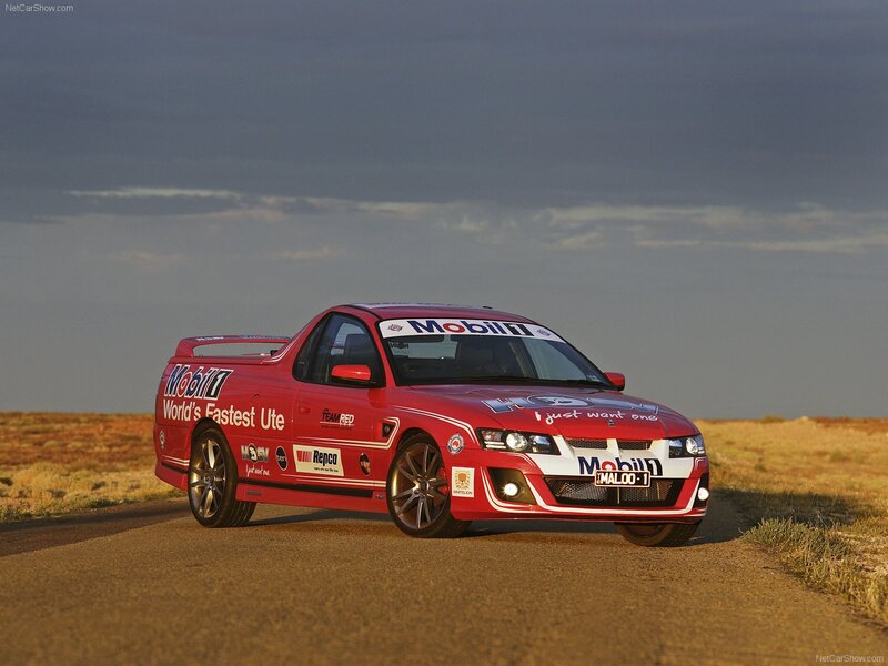 red racing ute on a road
