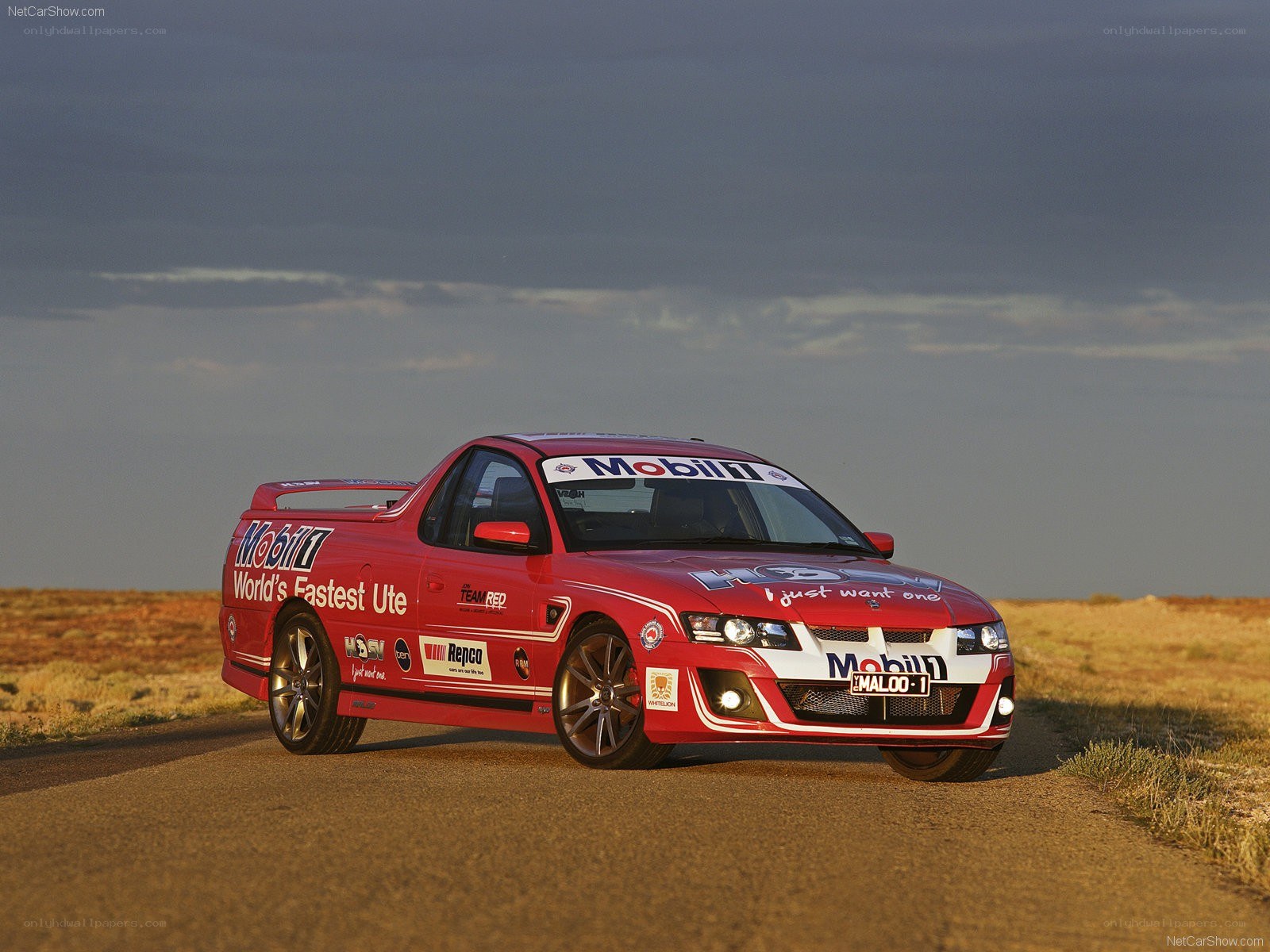 red racing ute on a road