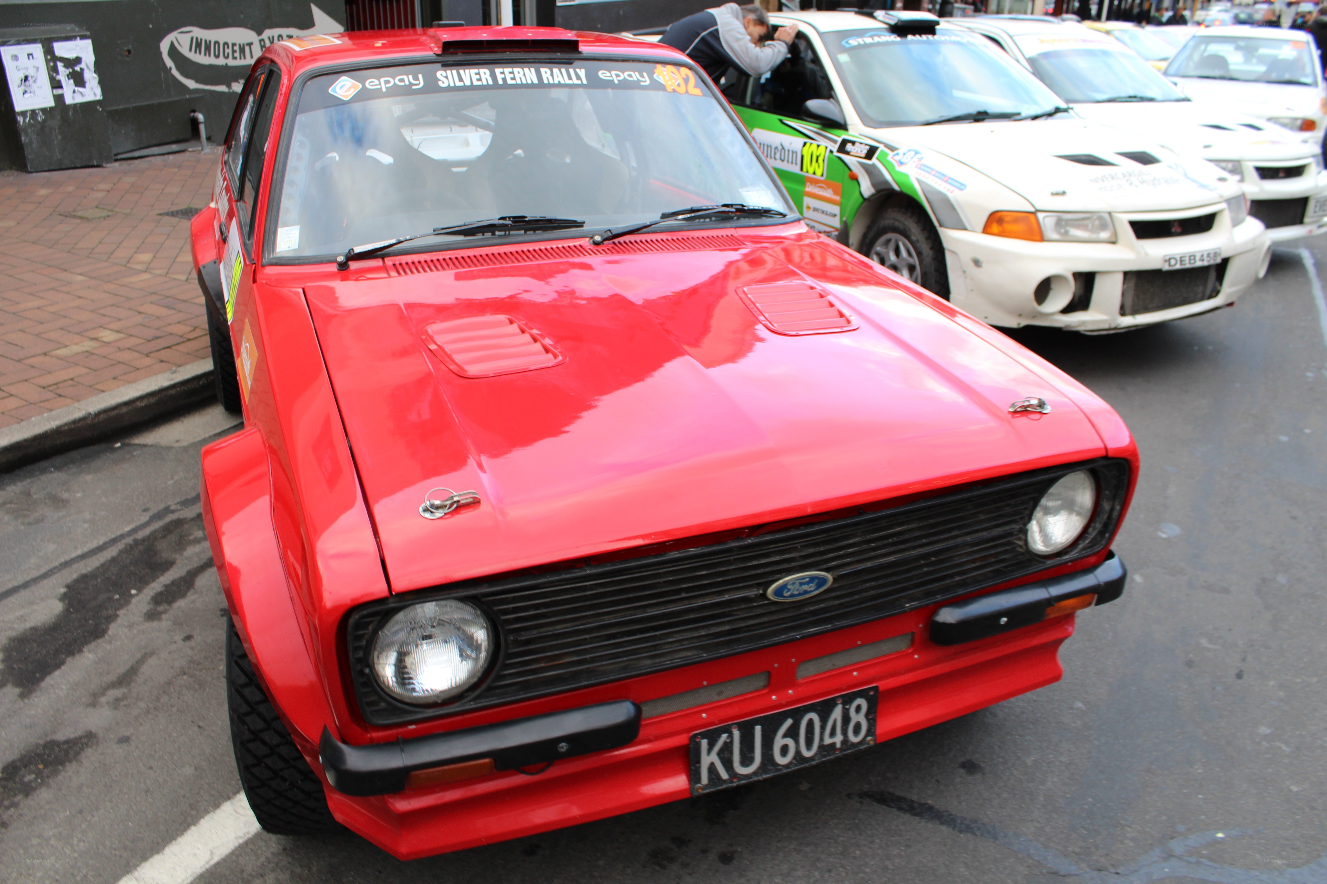 Red rally car at event