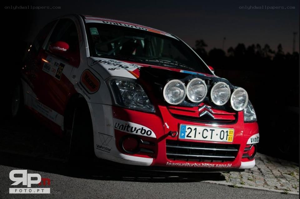 Red rally car at night