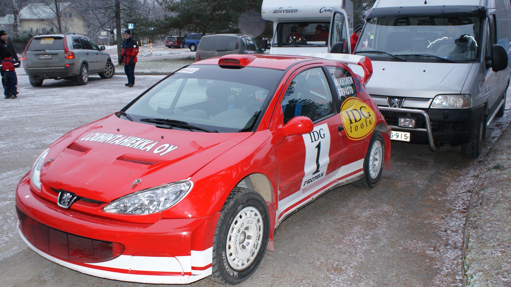 Red rally car at winter event
