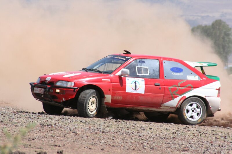 Red Rally Car — Dynamic, Afternoon, Photograph, Dust, Gravel