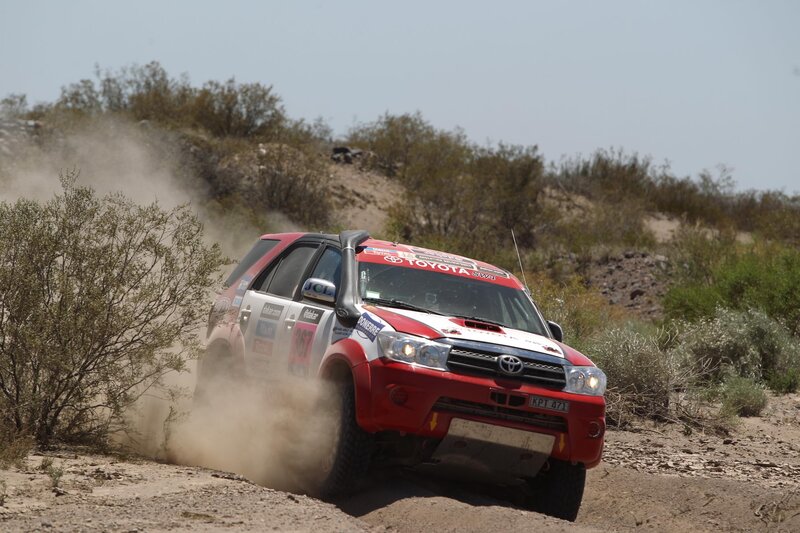 Red Rally Car — Dynamic, Afternoon, Photograph, Dust
