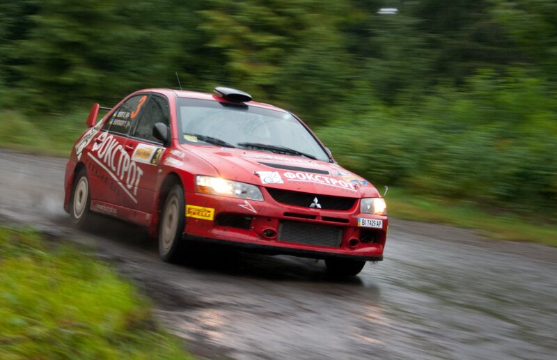 Red Rally Car — Dynamic, Photograph, Rally Car, Wet Road