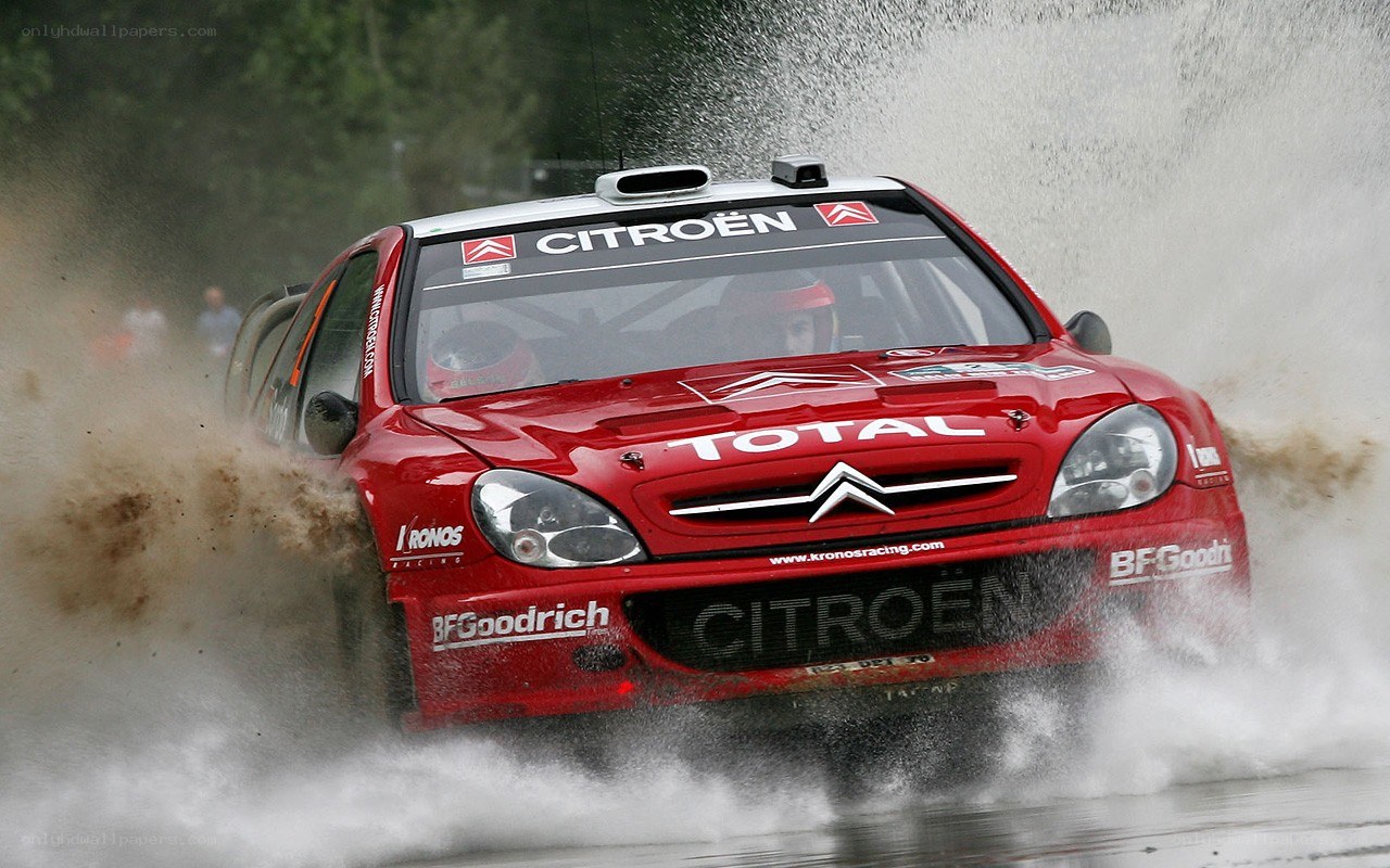 Red rally car in action