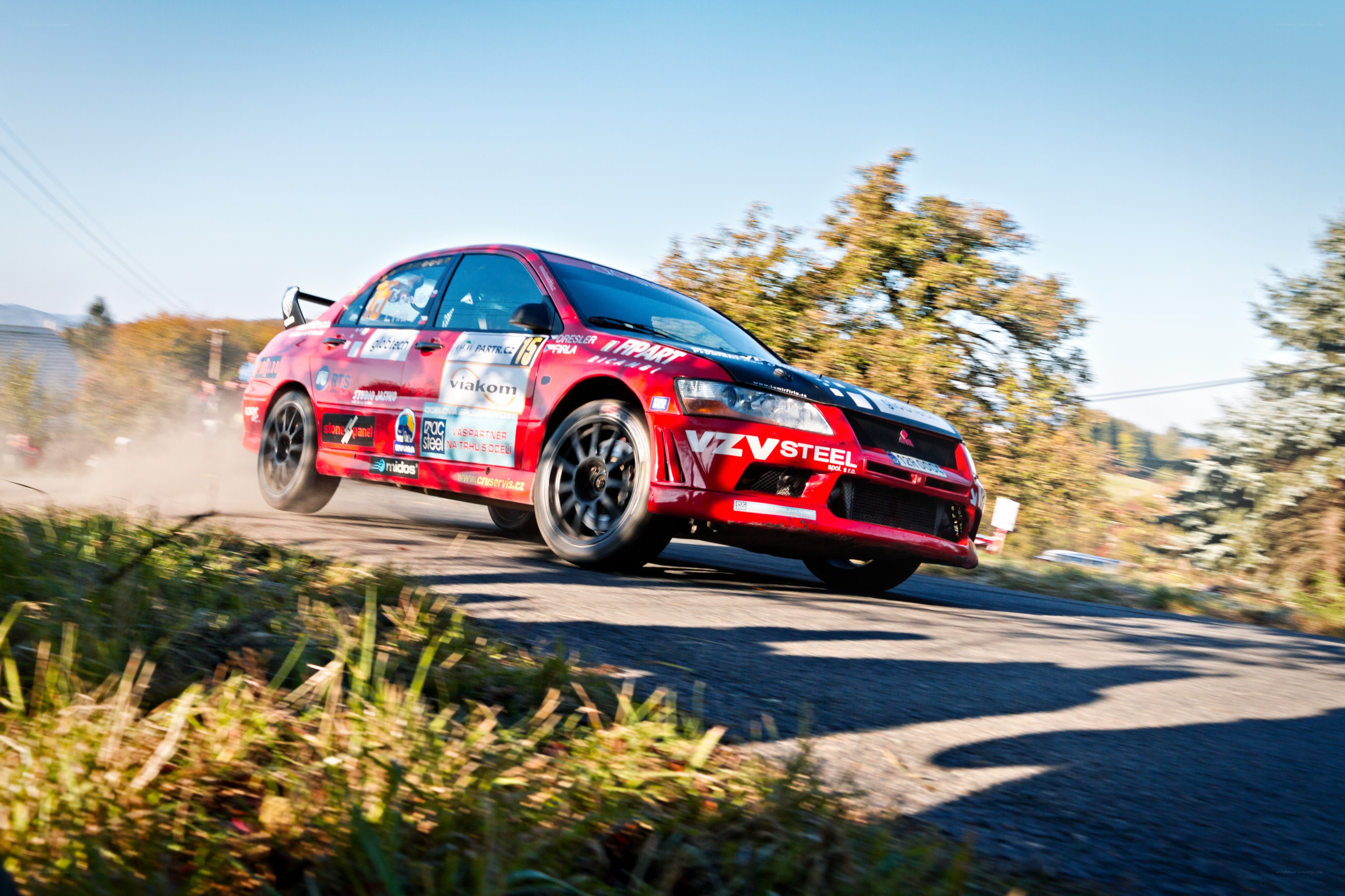 Red rally car in action